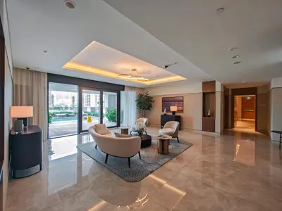 a lobby of a hotel with chairs and a living room at Stylish 1BR in Act One, Downtown Near Burj Khalifa in Dubai