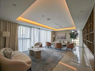 a hotel lobby with a waiting room with chairs and tables at Stylish 1BR in Act One, Downtown Near Burj Khalifa in Dubai
