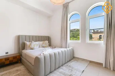 a bedroom with a large bed and two windows at keysplease 4 BR Villa private pool, Jumeirah Park in Dubai