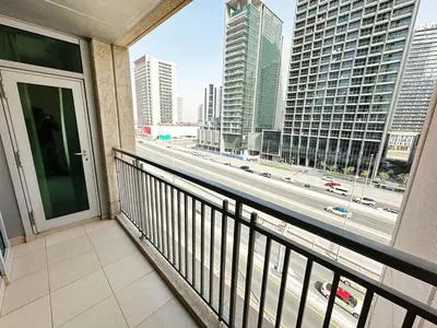 a balcony with a view of a city street at Step into Sophistication - Stylish 1-BR Apartment in Downtown Dubai by petals Holiday Homes in Dubai