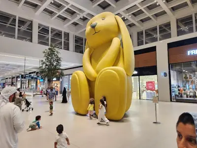 a large yellow balloon in the middle of a mall at Park Point C-1 bedroom for monthly stay-1005 in Dubai