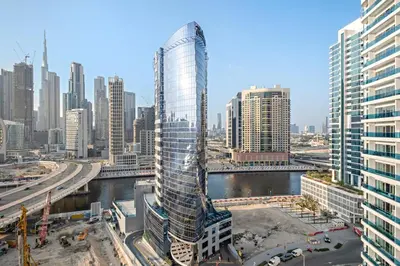 a rendering of a tall building in a city at Elegant 2BR with Balcony and Burj Khalifa Skyline Views in Dubai