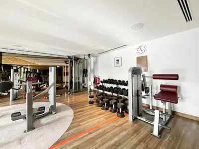 a gym with a bunch of equipment in a room at GuestReady - Luxurious interiors in Business Bay in Dubai
