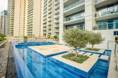 a swimming pool in the middle of a building at Cozy Retreat with Burj Views by Bnbeyond in Dubai