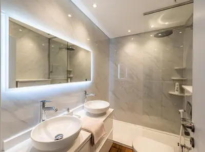 a bathroom with two sinks and a large mirror at 160M2 Modern 2-bedrooms apartment with fantastic views in Dubai