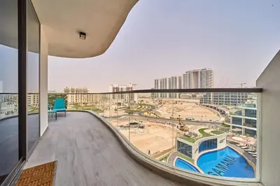 a balcony with a view of a city at FAM Living - Samana Park Views - Brandnew 1Bed in Dubai