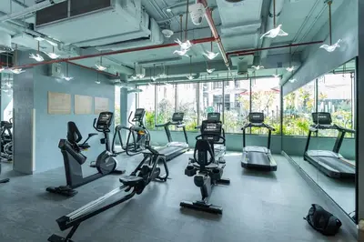 a gym with several cardio bikes and exercise bikes at Vogue Downtown Mag 318 near Burj Khalifa and Dubai Mall, Studio Apartment with Balcony, Canal and City View, Access to all Amenities in Dubai