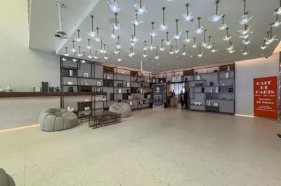 a large room with a bunch of lights in a building at Vogue Downtown Mag 318 near Burj Khalifa and Dubai Mall, Studio Apartment with Balcony, Canal and City View, Access to all Amenities in Dubai