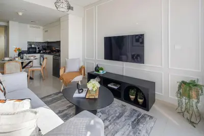 a living room with a couch and a table at Frank Porter - Aykon City Tower C in Dubai