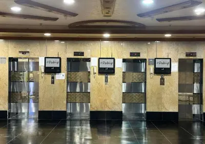 a row of lockers in a building with signs on them at Elegance Partition Room in Tecom Near ICM Metro in Dubai
