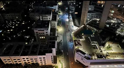an aerial view of a city at night at Network Partition Room Near Internet City Metro in Dubai