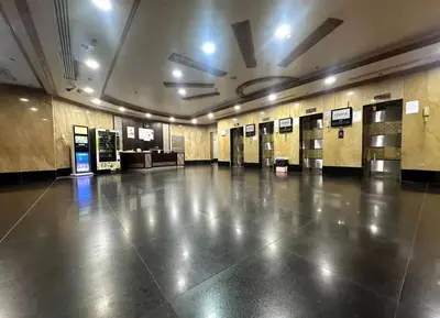a large empty room with ailed floor in a building at Network Partition Room Near Internet City Metro in Dubai