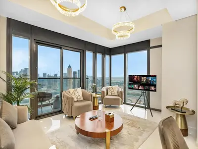 a living room with a view of the city at Lux Apartments in BusinessBay, Canal views, Great Location in Dubai
