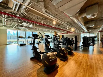 a gym with treadmills and cardio equipment in a building at Bright and Exquisite 1-Bedroom in Downtown views 2 in Dubai