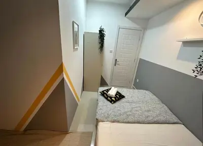 a small room with a staircase with a white door at Ideal Partition Room in Barsha 1 Near Metro in Dubai