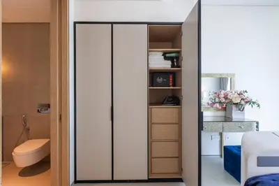 a bedroom with a sliding glass closet door at Elegant 2BR Apt Address Beach Resort in Dubai
