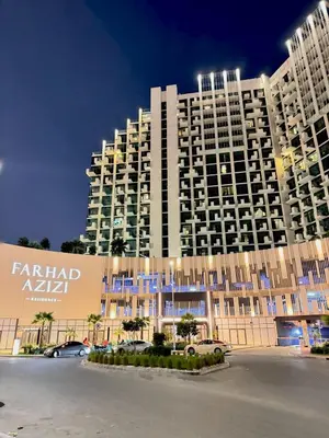 a large building in front of a parking lot at Modern Studio 15mins away From World Trade Center in Dubai