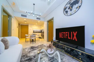 a living room with a television on a wall at CHIC Sea View 2Bhk 4pax in Dubai