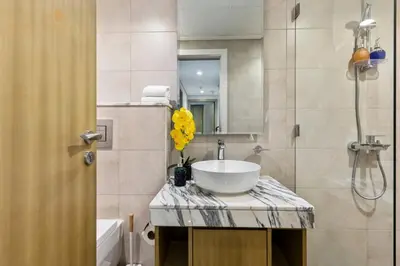 a bathroom with a sink and a shower at Exclusive Sea-View 3Bhk 6pax in Dubai