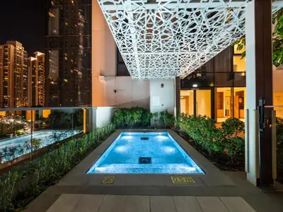 a swimming pool in the middle of a building at The Chic Downtown Suite Luxury near Burj Khalifa in Dubai