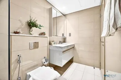 a bathroom with a sink and a mirror at Sleek 1BR w Canal Views Next to Dubai Mall in Dubai