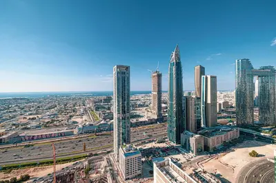 an aerial view of a city with tall buildings at LUXE - 2BR - Sea & City View - 5 Min to Dubai Mall in Dubai