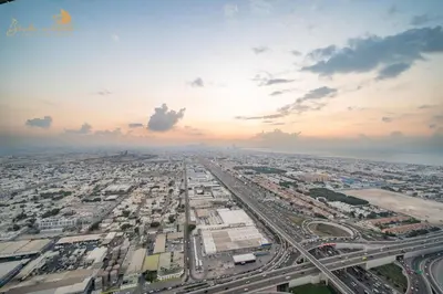 an aerial view of a large city with traffic at Glorious Sea View 3Bhk 6pax in Dubai