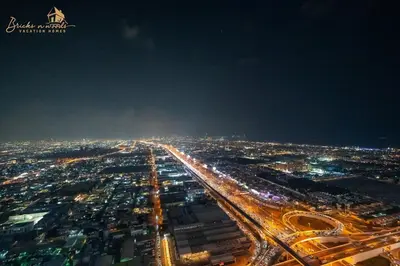 an aerial view of a city at night at Sea & Sunset View 2Bhk 5pax in Dubai