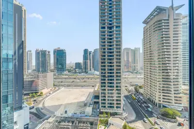 an aerial view of a city with tall buildings at Dubai Marina Elegant 1 BR on the Canal in Dubai