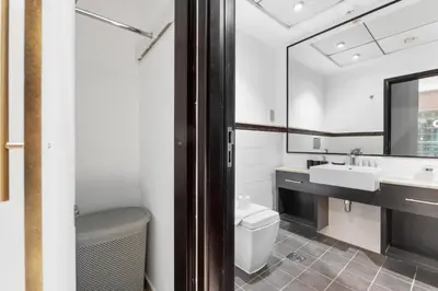a bathroom with a sink and a toilet and a mirror at Stunning 1 BR in JBR Dubai Marina The Walk in Dubai