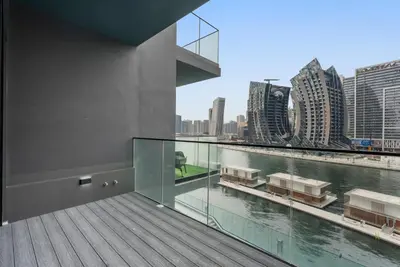 a balcony with a view of the water and buildings at Exclusive Apt 4 Pex with Burj Khalifa View in Dubai