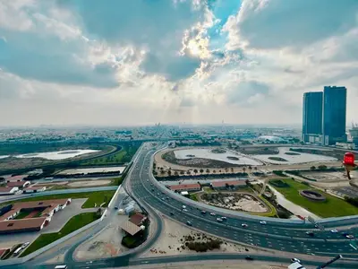 an aerial view of a city with a highway at Homes 2 Retreat - Luxury & Spacious 1BR with Balcony in Business Bay in Dubai