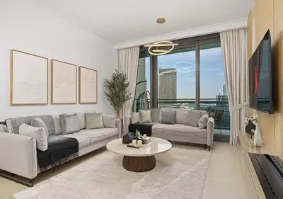 a living room with a couch and a table at Royal Vista - Luxury 2BR Apartment with Burj Khalifa View at Burj Vista - Downtown in Dubai