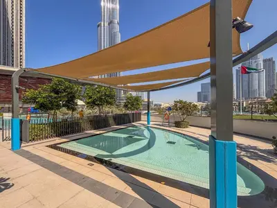 a swimming pool on the roof of a building at Frank Porter - Grande Signature Residences in Dubai