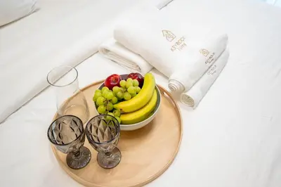 a plate of fruit on a table with glasses at KeyRock Luxury Apartment at Aykon Tower with Views in Dubai