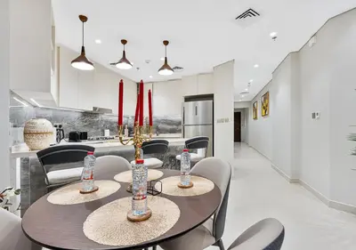 a dining room with a table and chairs at 2BR Central Apt in Business Bay Noble Tower in Dubai