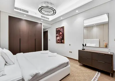 a bedroom with a large bed and a large mirror at 2BR Central Apt in Business Bay Noble Tower in Dubai
