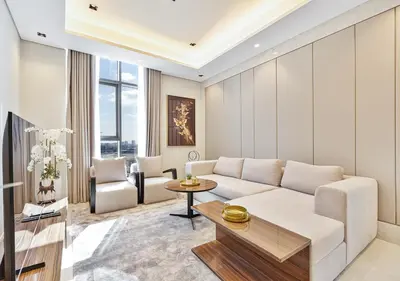 a living room with a white couch and a table at 2BR Central Apt in Business Bay Noble Tower in Dubai