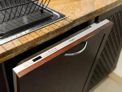 a close up of a dishwasher in a kitchen at WonderfulStay at The Residences - Best Burj Khalifa & Fountain View - Brand New Luxury Apartments in Dubai