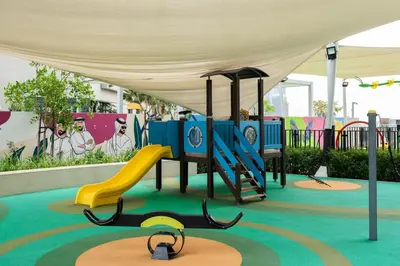 a playground with a slide and a slideintend at Keyrock Living - Luxe 2BR in Business Bay in Dubai