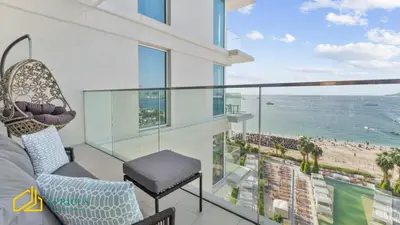 a balcony with a view of the ocean at Sea-view 2BD apt with private beach in La Vie in Dubai