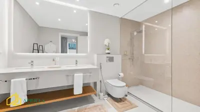 a bathroom with a sink and a toilet and a shower at Sea-view 2BD apt with private beach in La Vie in Dubai