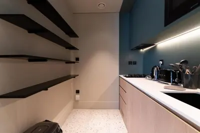 a kitchen with a sink and a counter top at Upside living business bay best in Dubai