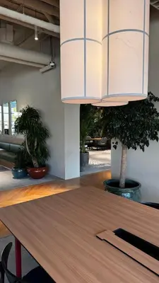a dining room with a table and a chandelier at Upside living business bay best in Dubai