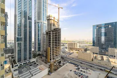 an aerial view of a city with tall buildings at Stylish 1BR with Balcony Near Marina Mall, Pool & Free Parking in Dubai