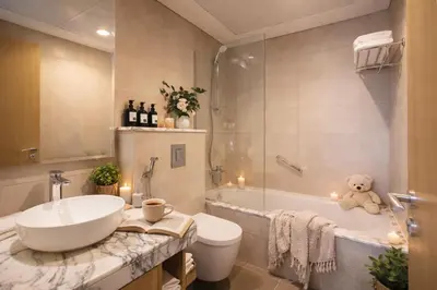 a bathroom with a tub and a sink and a toilet at KeyRock Luxury 2BR Apartment with City Views in Dubai