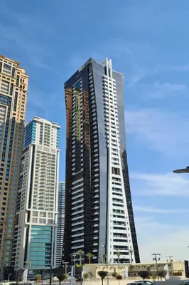 a tall building in the middle of a city at HAVN - Studio in Downtown, 10mins to Dubai Mall in Dubai