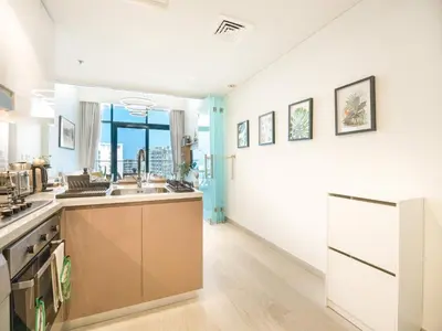 a kitchen with a sink and a counter top at EasyGo- Splendid Apartments in Al Meydan Living in Dubai