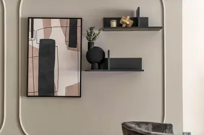 a living room with a mirror and a chair at GuestReady - Downtown oasis with Burj Khalifa view in Dubai