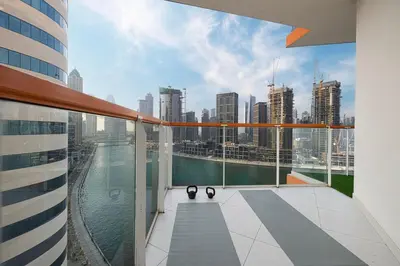 a balcony of a building with a view of a city at Panoramic! Burj Khalifa and Canal View! in Dubai